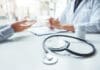 Your Doctor Isn’t Infallible! Doctors and patients consulting and diagnostic examining sit and talk. At the table near the window in the hospital medicine concept