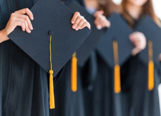 Congratulations to the Rocky Bayou Christian School Graduating Class of 2023! Close up group of graduates holding a hat At the graduation ceremony.