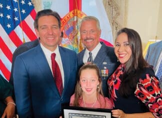 Bay Buzz December 2023 BB Norah Hall FamilyandGovernorDeSantis_WINNERof2023HispanicHertigageMonthEssayContest_10.10.23