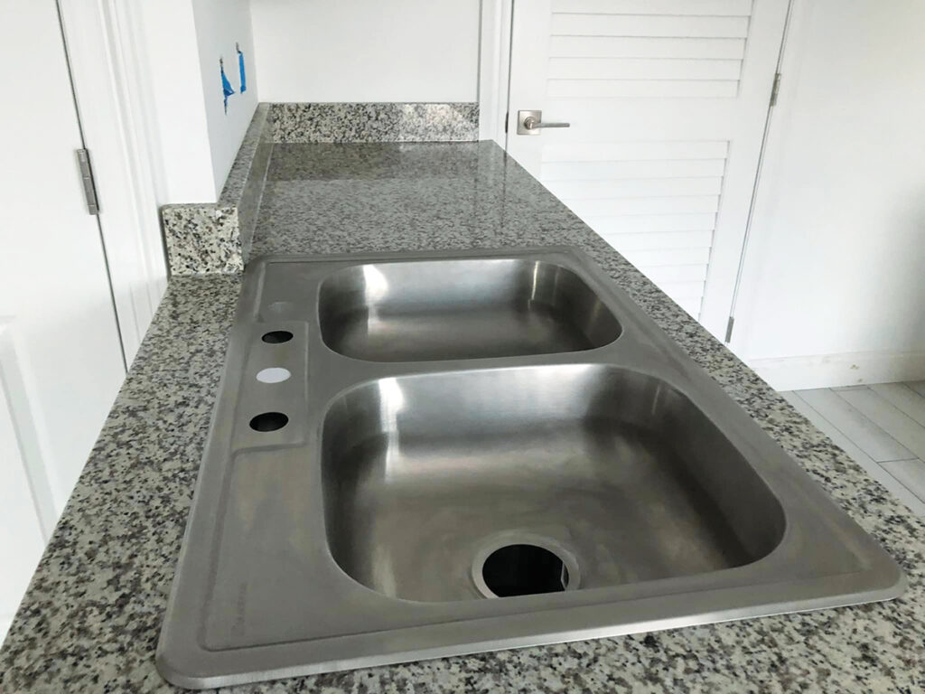 CALM Village Niceville home sink and cabinets