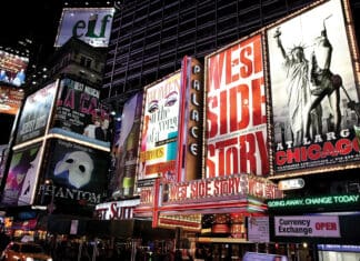 Embrace Musical Theatre New York, USA - November 07, 2010: Times Square, featured with Broadway Theaters and huge number of LED signs, is a famous symbol of New York City and the United States in Manhattan, New York City.