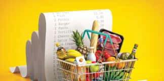 Shopping basket with foods on receipt. Grocery expenses budget, inflation and consumerism concept.