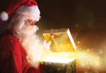 Traditional Santa Claus With Gifts And Sparkle Stars