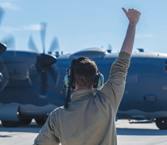 A 4th Special Operations Maintenance Squadron Airman directs a 4th Special Operations Squadron AC-130J Ghostrider gunship, as it prepares to taxi at Hurlburt Field, Florida, Dec. 4, 2024. The aircraft was used in a Next Generation Aircrew Protection team test to evaluate the effectiveness of chemical stimulant vapor purge systems during flight. (U.S. Air Force photo by Airman Samantha Rossi)