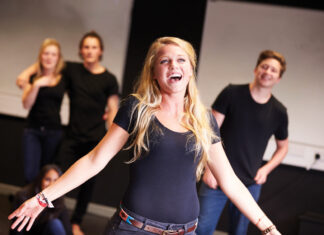 Students Taking Singing Class At Drama College