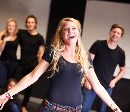 Students Taking Singing Class At Drama College