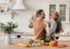 It’s Time to Exercise Happy Couple in Kitchen iStock 1328351784