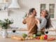 It’s Time to Exercise Happy Couple in Kitchen iStock 1328351784