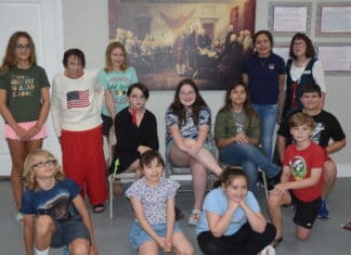 Museum Series Museum Camp in front of Trumbell painting siging the Declaration of Independence