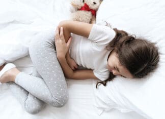 When the Gut Speaks First: Understanding the Back-to-School Stomachache child stomach ache iStock 1289373080